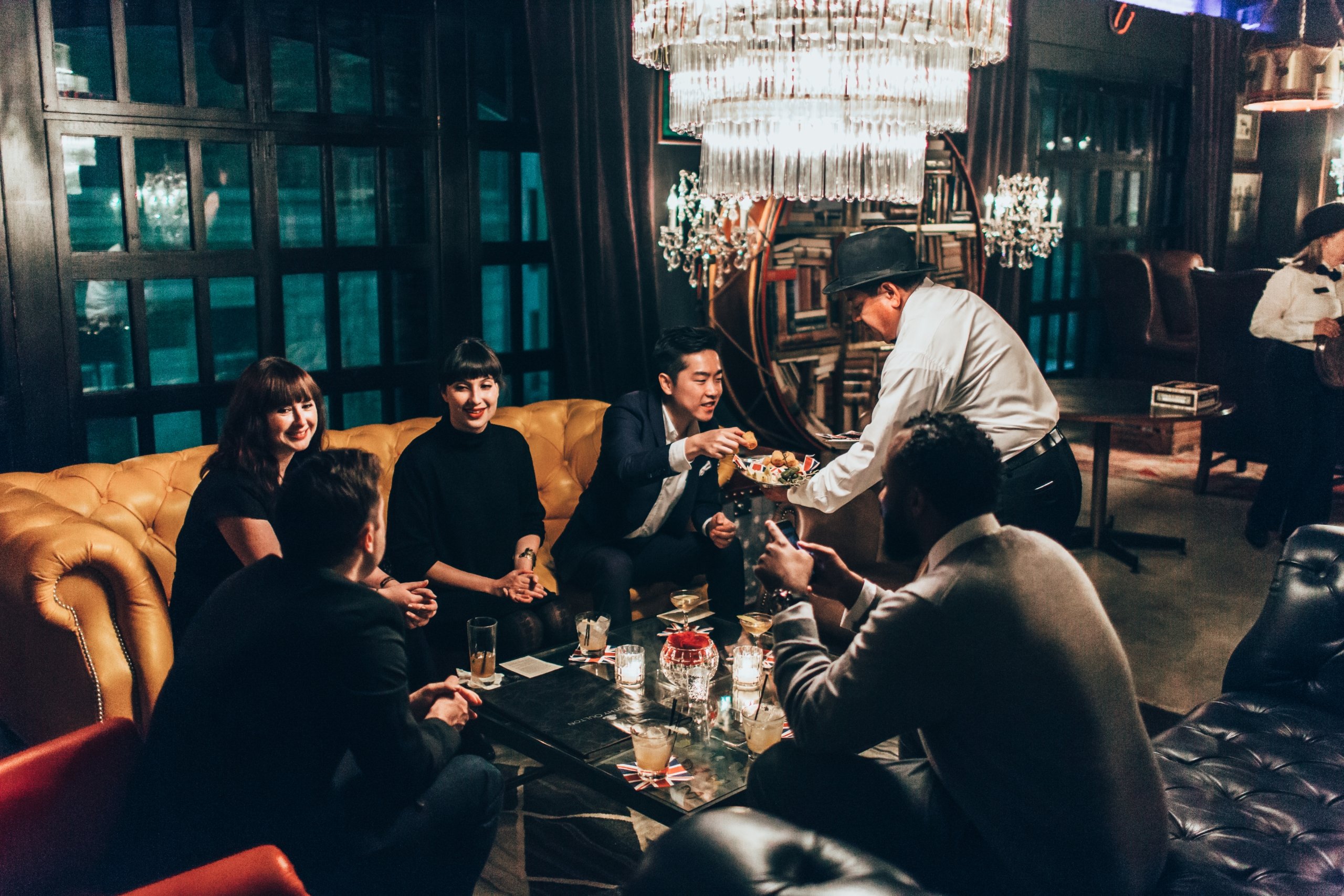 Group of friend having a good time at the Los Angeles Athletic Club Hotel bar, Blue Room in Downtown LA.