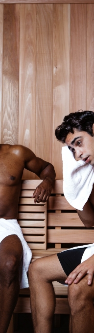 Two men sitting in a sauna