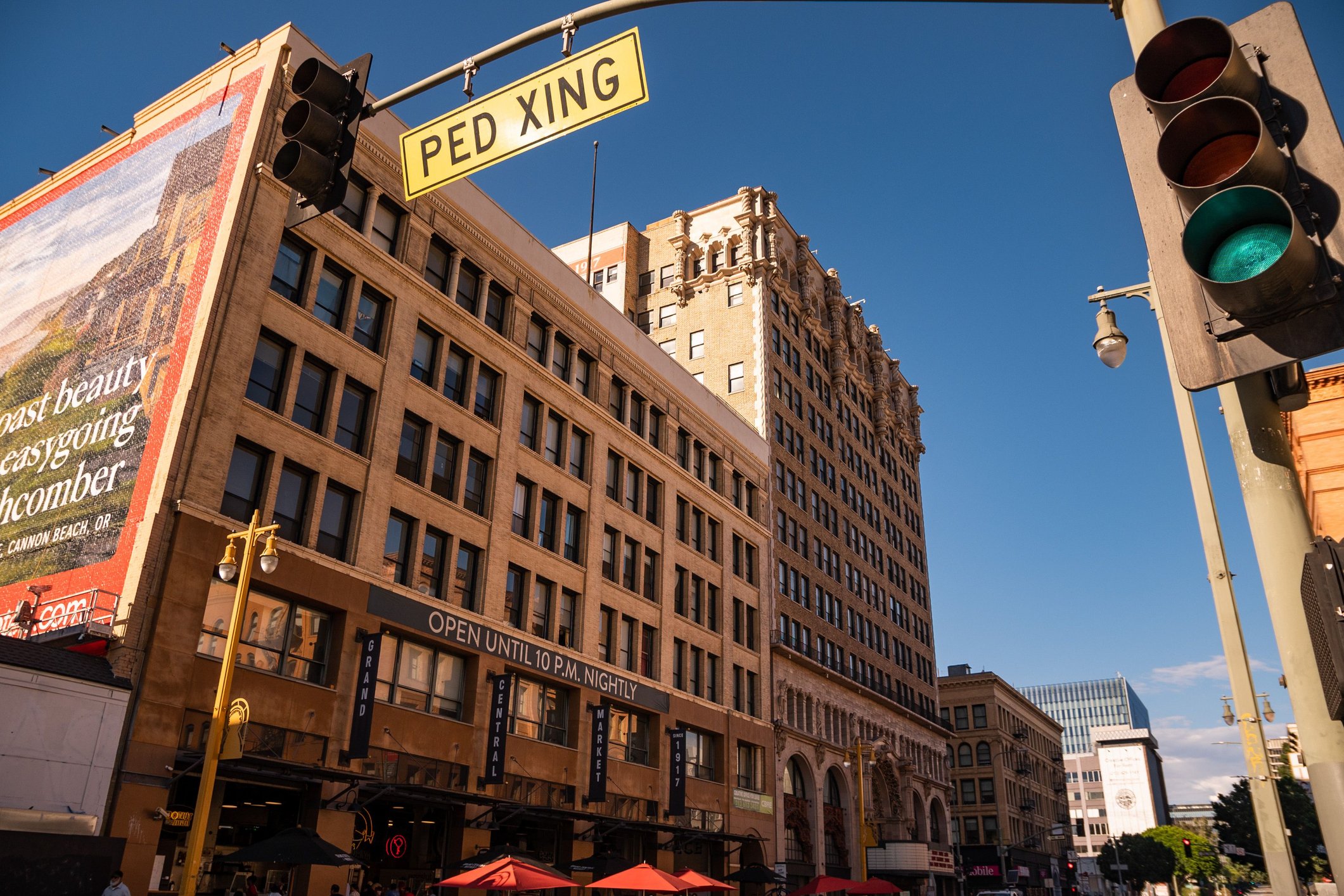 Los Angeles, United States – September 25, 2022: A traffic light and Grand Central Market in Los Angeles