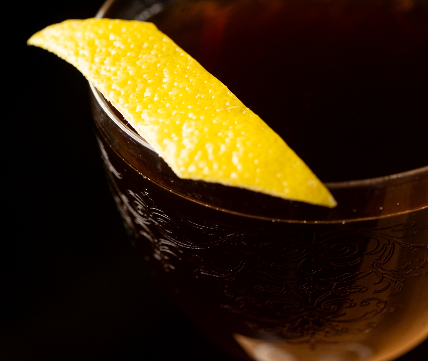 A lemon garnish on a cocktail